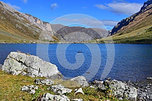 Russia, Arkhyz. Lake Zaprudnoye in autumn in sunnny day