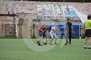 Russia - Berezniki on 25 July 2017: Little boys kids play indoor soccer in the open area at the sports city Junior Championships.