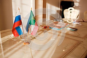 Russia Flag and the Republic of Khakassia on table in a registry office.