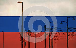 Russia flag with tram connecting on electric line with blue sky as background, electric railway train and power supply lines