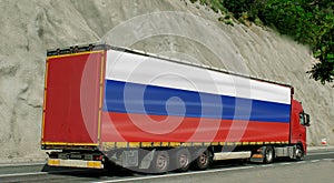 Russia- import-export concept. Truck carrying goods with the flag of Russia