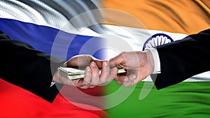 Russia and India officials exchanging money, flag background, cooperation