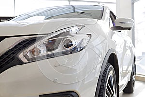 Russia, Izhevsk - February 19, 2021: Nissan showroom. New white Qashqai car in dealer showroom. Cropped image. Famous
