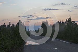 Russia, Karelia. White nights, forest road at sunset