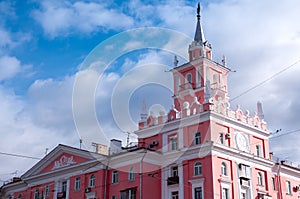 Komsomolsk-on-Amur, a pink building with a spire photo