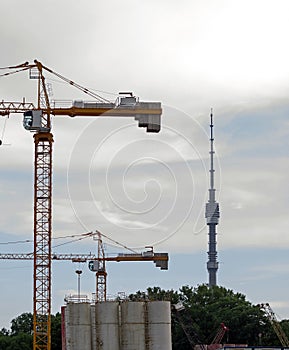 Russia, Moscow - construction cranes and Ostankino TV Tower