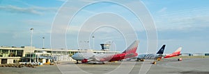 Russia, Moscow, Sheremetyevo airport, 16.08.2021. Planes are standing near the landing terminal, employees are preparing