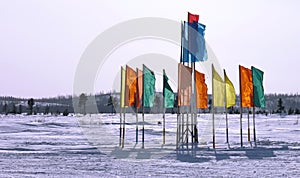 Russia, Nadym. Festive flags on the background of the Northern n