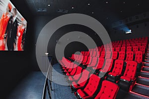 Russia, Nizhny Novgorod - may 26, 2014: Sormovsky Cinema. Empty red cinema hall seats, comfortable and soft chairs