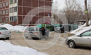 car stuck in the snow in an accident people push help