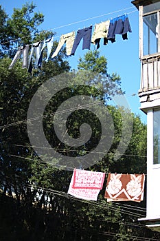 Russia, Petropavlovsk-Kamchatsky: Washed clothes hanging on a clothesline in the street