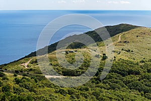 Russia, Primorskiy Region, historical monument on Gamov peninsula. Russian artillery battery turret gun, Cannon on the Hill.