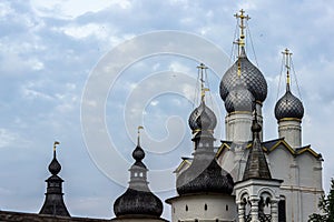 Russia, Rostov, July 2020. Domes of the church and roofs of watchtowers.