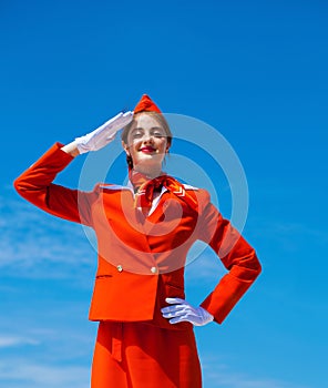 RUSSIA, SAMARA: 19 JULE 2019. Beautiful stewardess dressed in official red uniform of Aeroflot Airlines photo