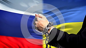 Russia sanctions Ukraine, chained arms, political or economic conflict, business