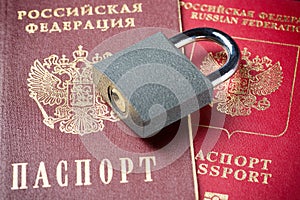 Russia Sanctions and Ukraine war concept. Russian Federation passports with padlock