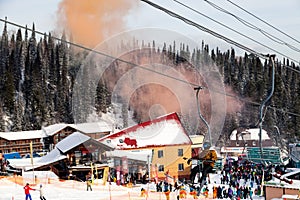 Russia, Sheregesh 2018.11.17 Snowboarders and skiers in the mountain resort, small cute chalets, cafes, funicular. The concept