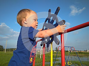 Russia,  a small child boy playing on the playground in the ship