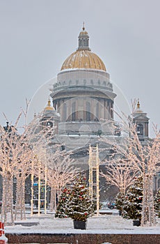 Russia, St Petersburg, 30 December 2023: people walk among Christmas trees in heavy snowfall, a park organized on