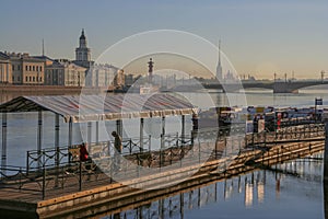 Russia, St. Petersburg, early morning on the Neva River, summer gentle dawn light, view of the pier and the Peter and Paul Fortres