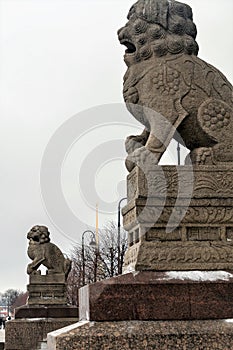 Russia, St. Petersburg, January 2021. Chinese lions guard the embankment of the city.