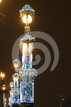 Russia, St. Petersburg, the lanterns of the Trinity Bridge in the dark