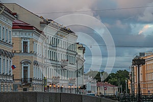 Russia, St. Petersburg, summer evening city, expressive architecture, street lights blue twilight light, textured pre-storm sky.