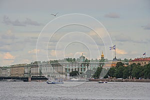 Russia, St. Petersburg, view of the Neva River, the Admiralty and the Winter Palace. A motor ship is sailing along the river. Summ