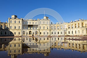 Russia, suburb of St. Petersburg. Great Gatchina Palace 1766 - 1781 and parade-ground. Reflection in pools after a rain