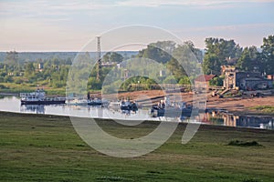 Russia, Syktyvkar, Komi Republic, Sysola River embankment in summer, pier, ships, modern and old buildings, contrast of time, life