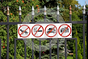 Russia. Tambov. Prohibiting signs on the fence Kazan Monastery photo
