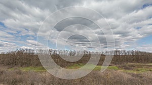 Russia, timelapse. The movement of clouds over the fields of winter wheat in early spring in the vast steppes of the Don.