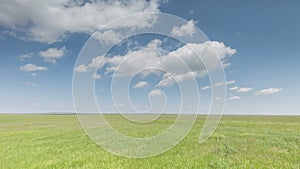 Russia, timelapse. The movement of clouds over the fields of winter wheat in early spring in the vast steppes of the Don.