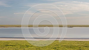 Russia, timelapse. The movement of clouds over the fields of winter wheat in early spring in the vast steppes of the Don.