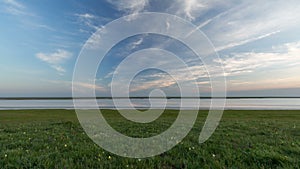 Russia, timelapse. The movement of clouds over the fields of winter wheat in early spring in the vast steppes of the Don.