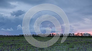 Russia, timelapse. The movement of the thunderclouds over the fields of winter wheat in early spring in the vast steppes of the Do