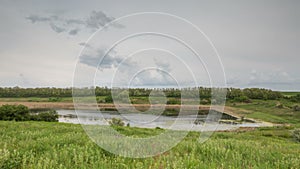 Russia, timelapse. The movement of the thunderclouds over the fields of winter wheat in early spring in the vast steppes of the Do