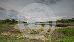 Russia, timelapse. The movement of the thunderclouds over the fields of winter wheat in early spring in the vast steppes of the Do