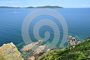 Russia, Vladivostok, Amur Bay, the view for the island of Popov from the island of Klykov in sunny day photo