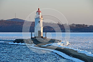 Russia. Vladivostok. The lighthouse of Egersheld1876 year built at the tip of the Peninsula of Shkot - Tokarevskaya koshka in w