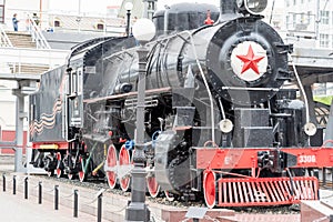 Russia, Vladivostok, 07/06/2019. Old train locomotive as monument on the platform of railway station Vladivostok. This monument is