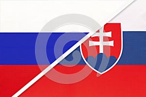 Russia vs Slovakia national flag from textile. Relationship and partnership between two countries