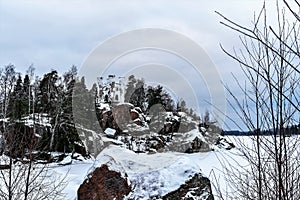 Russia, Vyborg, January 2021. Rocky island with a chapel in Mon Repos park.