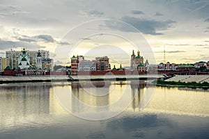 Russia, Yoshkar-Ola, July 24, 2020, sunset, view from the embankment of the Kokshaga river to the Kremlin, reflection in photo