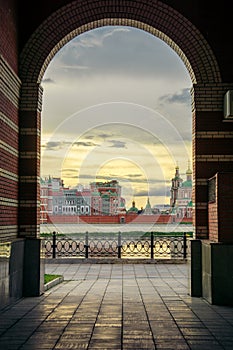 Russia, Yoshkar-Ola, July 24, 2020, view through the arch on the embankment of the Kokshaga river, the bridge and the photo