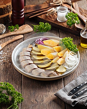 Russian appetizer platter pickles herring potatoes