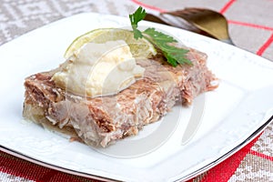 Russian aspic - kholodets with chopped horseradish (chren)