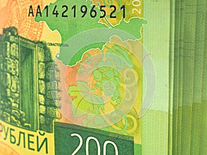 Russian banknote of 200 rubles. The banknote depicts a map of Crimea and its attractions