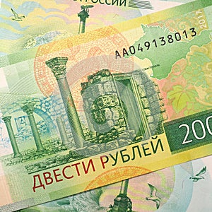 Russian banknote 200 rubles. The banknote depicts the sights of Tauric Chersonesos and a map of Crimea. Close-up