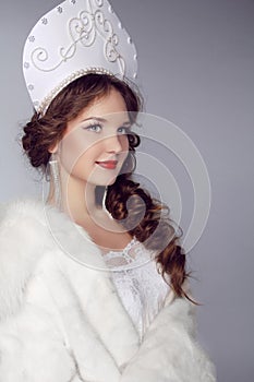 Russian Beauty. Attractive female wearing in kokoshnik. Woman's